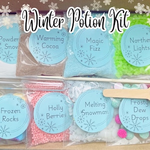 May include: A winter potion kit containing ingredients like "Powder Snow" and "Warming Cocoa" in clear bags, each labelled with a snowflake design. The kit also includes a wooden spoon and stirring rod. The text "Winter Potion Kit" is visible.