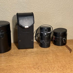 4 custodie in pelle per obiettivi fotografici; Nikon, Tamron, Olympus, Topcon