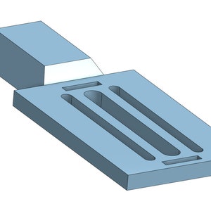 May include: A light blue plastic mold with three long, narrow, rectangular slots and a smaller rectangular slot at the bottom.
