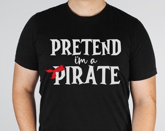 May include: Black t-shirt with white text that reads "Pretend I'm a Pirate" with a red bandana graphic.