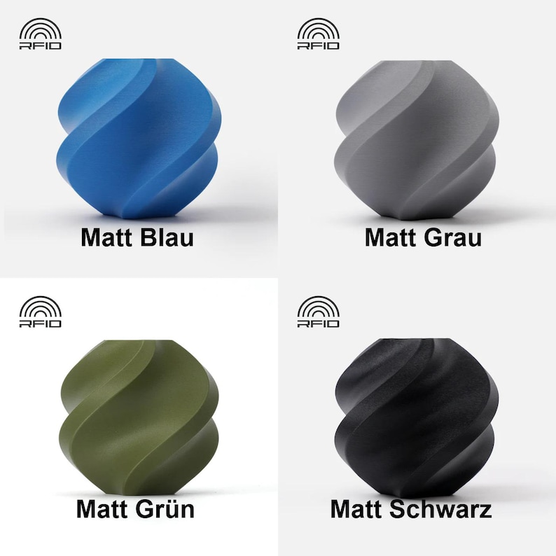 May include: Four different colored, matte finished, twisted, geometric shapes. The colors are blue, gray, green, and black. The shapes are labeled with the color in German.