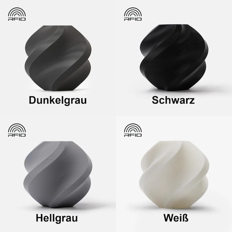 May include: Four ceramic vases in different colors: dark gray, black, light gray, and white. Each vase has a unique twisted design.