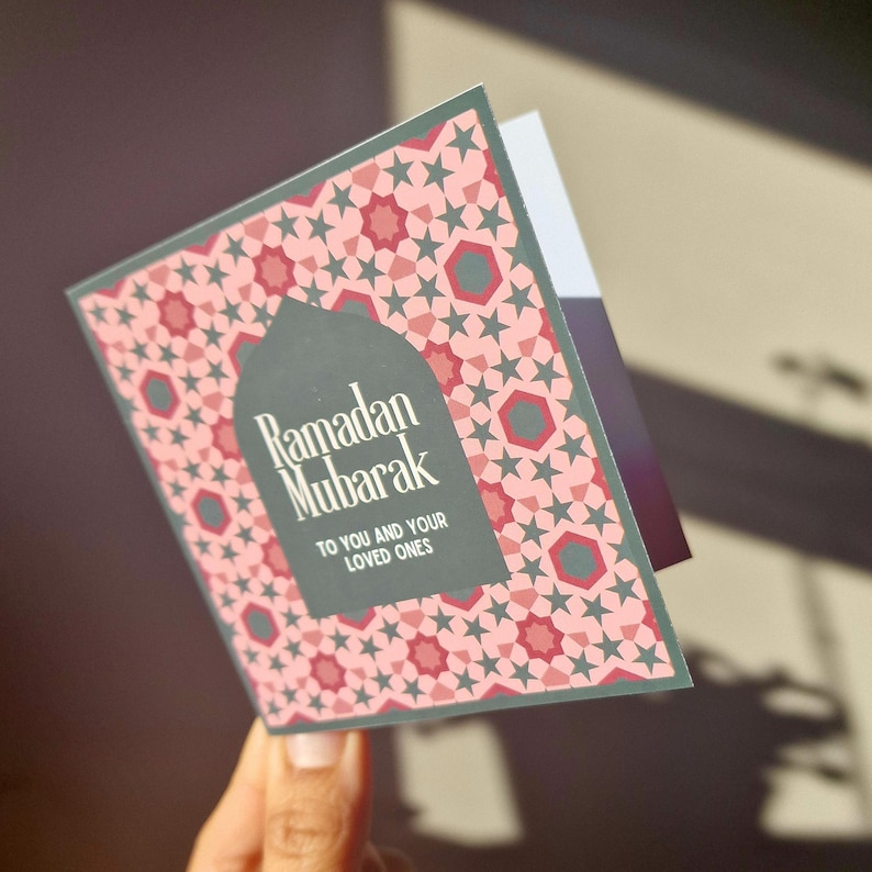 Pack of 8 mini Ramadan Eid cards with Islamic geometric designs, in a maroon (red), pink and green colourway. Each mini card measures 10 x 10cm each, and comes with a white envelope. Perfect for gift giving during Ramadan and Eid.