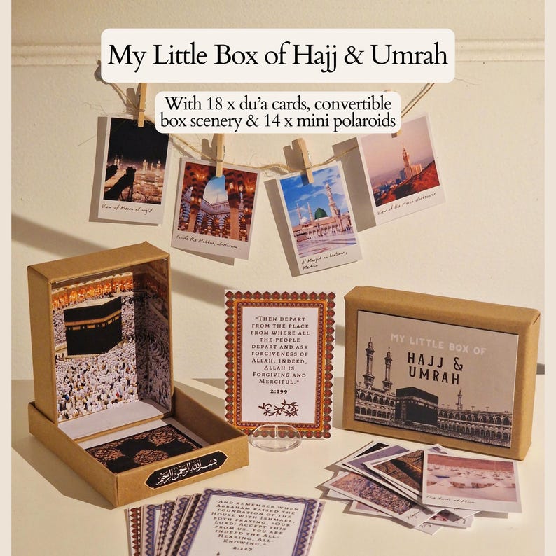 May include: A brown box with a scene of the Kaaba inside. The box is labeled "My Little Box of Hajj & Umrah". The box comes with 18 du'a cards and 14 mini polaroids.