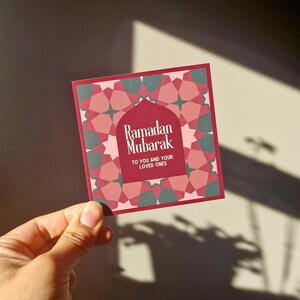Pack of 8 mini Ramadan Eid cards with Islamic geometric designs, in a maroon (red), pink and green colourway. Each mini card measures 10 x 10cm each, and comes with a white envelope. Perfect for gift giving during Ramadan and Eid.