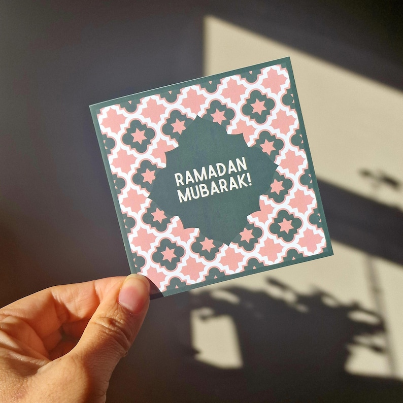 Pack of 8 mini Ramadan Eid cards with Islamic geometric designs, in a maroon (red), pink and green colourway. Each mini card measures 10 x 10cm each, and comes with a white envelope. Perfect for gift giving during Ramadan and Eid.