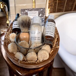 Deluxe shaving kit includes: 2 shaving bars, shaving bowl and brush, beard oil, beard balm, aftershave lotion, liquid hand soap and small guest soaps.