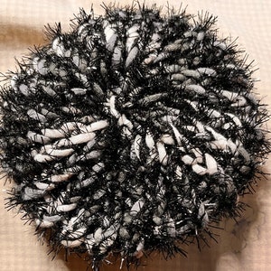 black and white reusable scrubby for multiple surfaces.