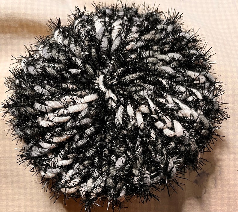 black and white reusable scrubby for multiple surfaces.