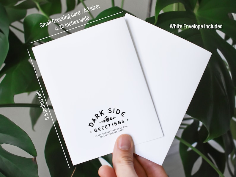 May include: A white greeting card with a white envelope. The card is 4.25 inches wide and 5.5 inches tall. The card has the text "DARK SIDE GREETINGS" and the website address. The envelope is included.