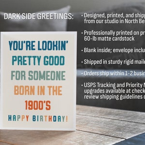 May include: A birthday greeting card with the text "YOU'RE LOOKIN' PRETTY GOOD FOR SOMEONE BORN IN THE 1900'S HAPPY BIRTHDAY!" in blue, teal, and orange. The card is on a wooden surface.