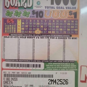 May include: A green bingo game card with the title "4 on a Board" and a total seal value of $1000. The card has a bingo grid with numbers 1-75 and a list of hold numbers from 101-175. The card also has a serial number of 2M42526.