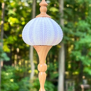 Lightweight hand-turned Christmas ornament with sea urchin shell and Wisconsin cherry wood.