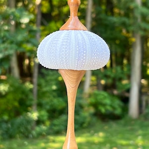 Hand-turned lightweight Christmas ornament with sea urchin shell and Wisconsin cherry wood.