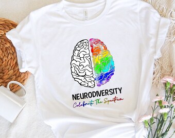 May include: White t-shirt with a rainbow brain graphic and the text "Neurodiversity Celebrate The Spectrum".
