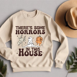 There&#39;s some Horrors in this house sweatshirts, Spooky horror sweatshirts, Funny Halloween graphics,Unisex Heavy Blend™ Crewneck Sweatshirt