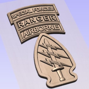 May include: A wooden cutout of the Special Forces, Ranger, and Airborne tabs, along with the Special Forces insignia. The tabs are curved and the insignia is a stylized arrowhead with lightning bolts and a sword.