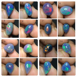 May include: A collection of sixteen loose, polished opals in various shapes, including teardrop, oval, and triangular cuts. Each gemstone displays a dark blue base color with vibrant, multi-colored flashes of red, green, and orange play-of-color.