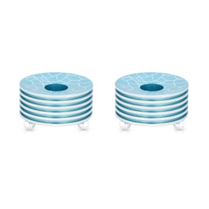 May include: Two blue and white candle holders with a geometric pattern. Each holder has a circular base with three silver feet.