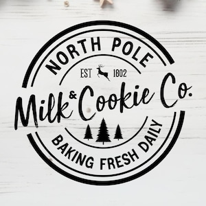 May include: Black and white logo with the text "North Pole Milk & Cookie Co. Baking Fresh Daily" and a reindeer silhouette. The logo is surrounded by two concentric circles.
