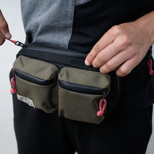 Unisex sling bag in Deep Green color. Made with Cordura fabrics.