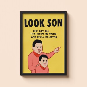 May include: Framed art print with a yellow background and the text "LOOK SON". The image features a cartoon illustration of a father and son, with the father pointing. The text below reads "ONE DAY ALL THIS WON'T BE YOURS AND YOU'LL DIE ALONE".