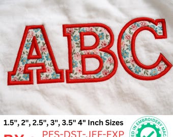 May include: Applique font featuring the letters A, B, and C. Each letter has a red border and is filled with a floral pattern in pink, blue, and white. The image includes text indicating sizes from 1.5 to 4 inches.