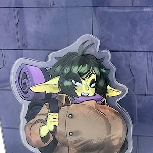 May include: A green-skinned character with purple hair and large ears is wearing a brown jacket and a purple scarf. The character is carrying a purple sleeping bag on their back.