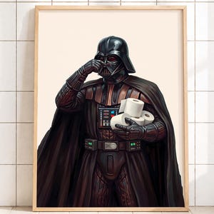 May include: A framed print featuring Darth Vader holding toilet paper. The artwork depicts the iconic character in his signature black armor and helmet, with a humorous twist. The print is set against a neutral background.