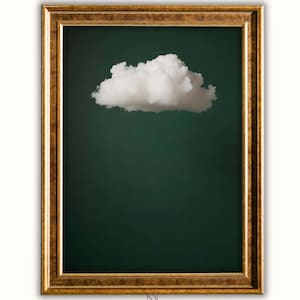 Puede incluir: Impresión artística enmarcada con una nube blanca sobre un fondo verde oscuro. La nube está centrada, creando una estética minimalista. El marco dorado añade un toque de elegancia a la obra. Una obra de arte simple y serena.