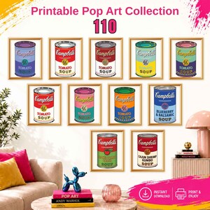 May include: A collection of 110 printable pop art wall prints featuring various Campbell's soup cans in different color schemes, including tomato, blueberry and balsamic, and cajun shrimp gumbo, displayed in gold frames on a white wall.
