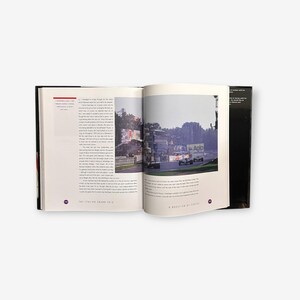 May include: An open book with a photo of a race track with several cars driving on the track. The book is titled "The Italian Grand Prix" and "A Question of Styles".