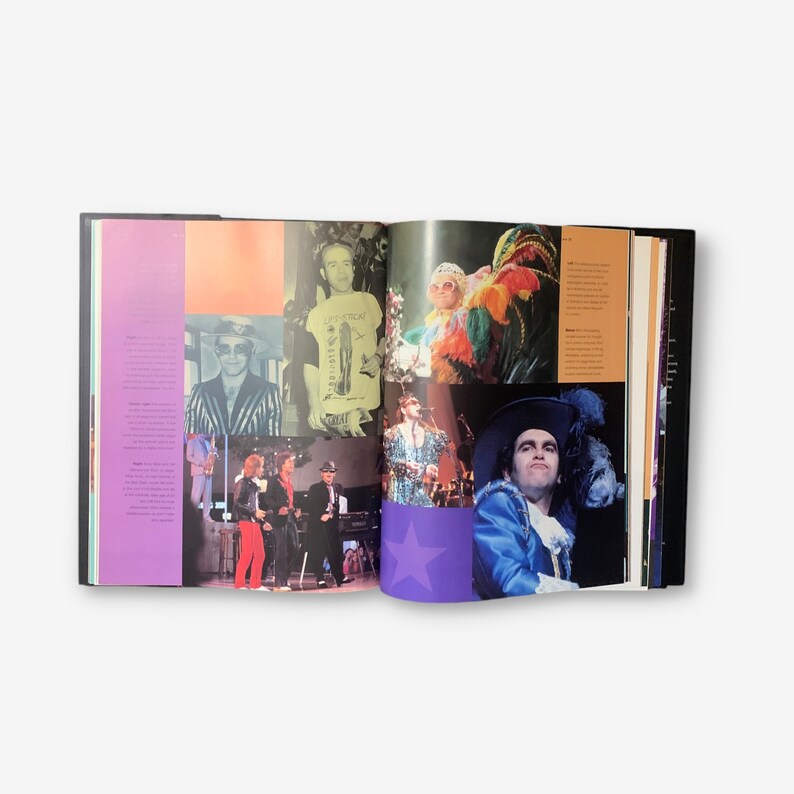 May include: An open book with a purple, pink, and yellow background. The book features a collage of photos of a man wearing different outfits and hats. The text on the page reads "The Greatest Hits".