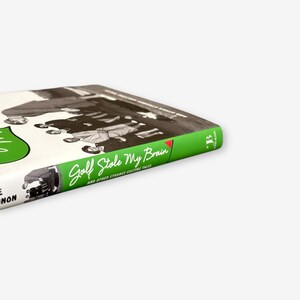 May include: A book titled "Golf Stole My Brain" with a green spine and cover text. The cover features a black and white image of people and a green shape. The book's title is in a cursive font.