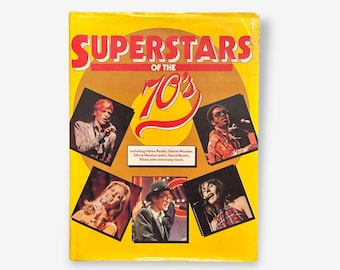May include: A retro book cover in yellow and red, titled "Superstars of the 70's". The cover displays images of musicians and the text "Superstars of the 70's" with a list of names including Helen Reddy, Stevie Wonder, and David Bowie.