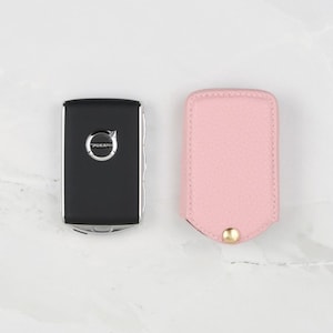 Pink Volvo Key Fob Leather Cover with Pebble Grain Texture and Keychain
