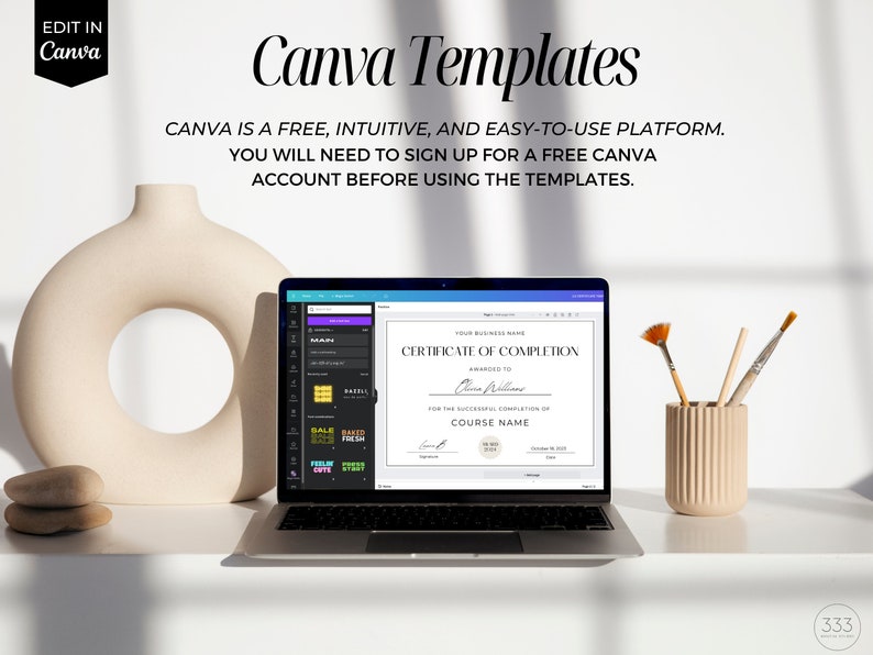 May include: A laptop computer displaying a Canva template for a certificate of completion. The template is white with black text and a gold seal. The laptop is on a white desk with a vase, rocks, and paintbrushes.
