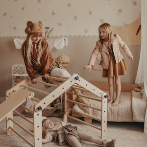 May include: Three children playing on a wooden climbing structure with a slide and a ladder. The structure is made of natural wood and has a light brown finish. The children are wearing casual clothing and are having fun.