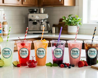May include: Six clear plastic cups filled with various colorful beverages, each featuring a circular logo that reads Dirty Soda. The drinks are garnished with fruit, including lime slices, cherries, strawberries, and mango, and each cup contains a colorful straw.