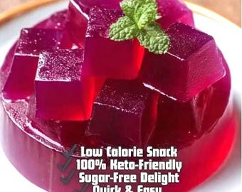 May include: A vibrant, red-purple dessert with a clear, gelatinous appearance, topped with cubed pieces and a sprig of mint. The text on the image reads: Low Calorie Snack, 100% Keto-Friendly, Sugar-Free Delight, Quick & Easy.