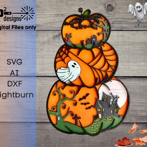 May include: A layered pumpkin design with Halloween themes. The pumpkins are orange with black and green details. The design includes a ghost, bats, a haunted house, and a graveyard.  Digital Files only. SVG, AI, DXF, Lightburn.