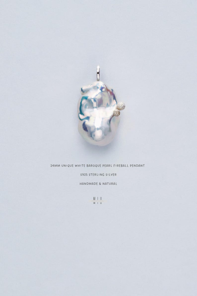 May include: A white baroque pearl fireball pendant crafted from sterling silver. The pearl measures 24mm in diameter and has a distinctive, irregular shape. The pendant is handmade and natural.