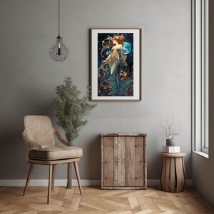 May include: A framed art print featuring a woman in a flowing blue gown with gold accents, standing in front of a blue moon and a starry background.