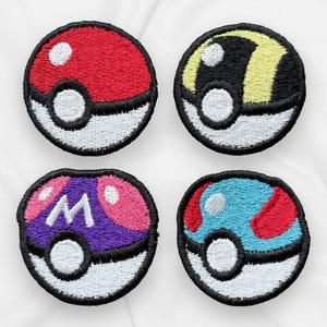 May include: Four embroidered iron-on patches featuring the Pokeball design in different colour combinations. The patches are circular and feature a white centre with a black outline. The top left patch is red, white, and black. The top right patch is yellow, black, and white. The bottom left patch is purple, pink, and white. The bottom right patch is blue, red, and white.