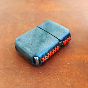 Special effect black leather Zippo lighter case with orange neon stitching. Ideal gift for dad & men. Stylish and protective. Great leather