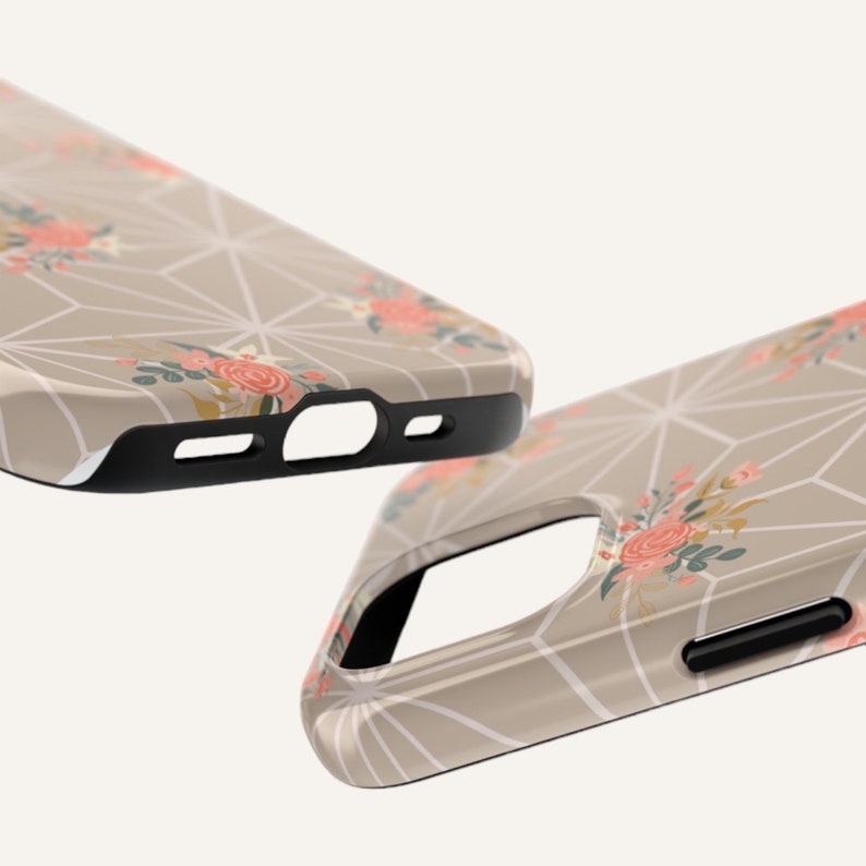 May include: A beige phone case with a geometric pattern and floral accents. The case has a black bumper and a cutout for the camera lens.