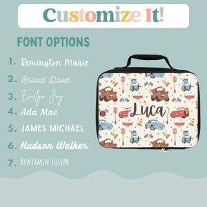May include: A black lunch bag with a Cars-themed design featuring red and blue cars, traffic lights, and cones. The bag has a zipper closure and a handle. The name "Luca" is printed on the front of the bag.