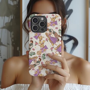 May include: A white phone case with a repeating pattern of Rapunzel and Flynn Rider from the Disney movie Tangled. The characters are illustrated in a cartoon style and are surrounded by flowers and a green chameleon.