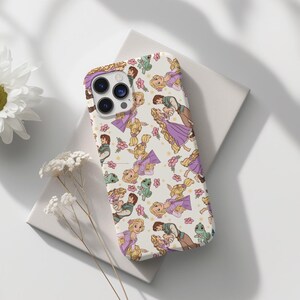 May include: A white phone case with a repeating pattern of Rapunzel and Flynn Rider from the Disney movie Tangled. The characters are depicted in a cartoon style with purple and yellow accents.