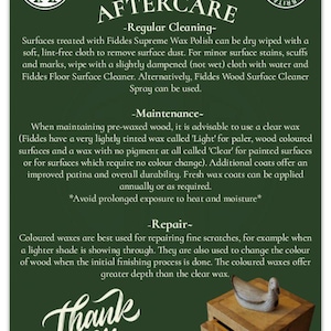 May include: Green and white text on a dark green background with instructions for caring for wood surfaces. The text includes the words "Taffy & Tate Aftercare" and "Handmade in Great Britain".